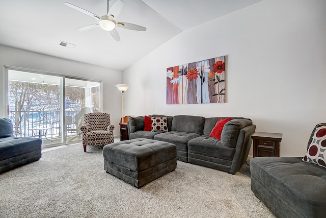 living room with ceiling fan, light colored carpet, and lofted ceiling