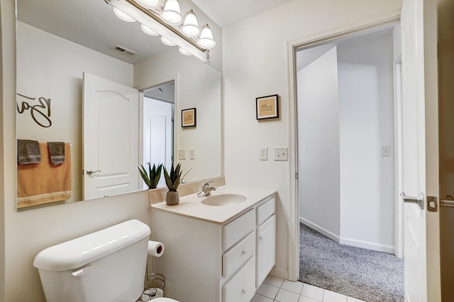 bathroom featuring tile patterned floors, vanity, and toilet