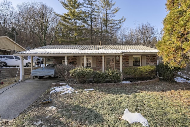 ranch-style home featuring a carport