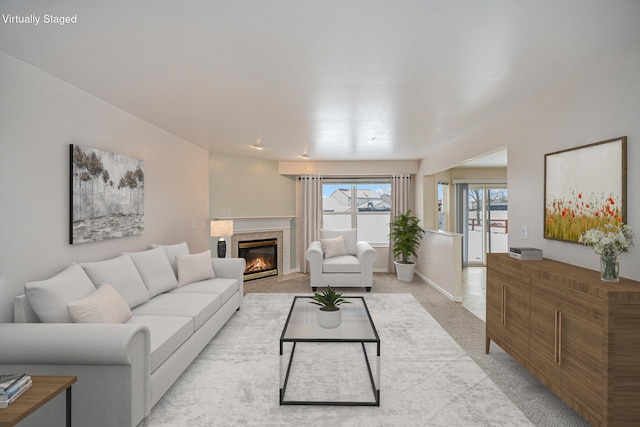 living room featuring a premium fireplace and light carpet