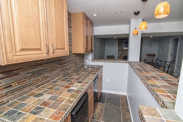 kitchen featuring decorative backsplash, sink, and decorative light fixtures