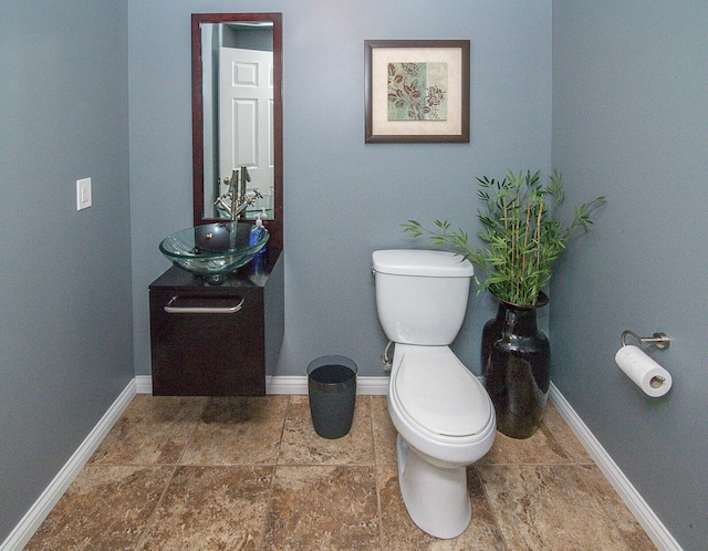 bathroom with toilet and vanity