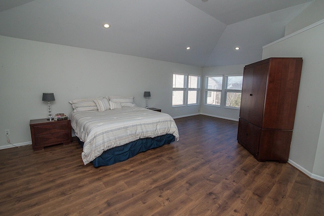 bedroom with vaulted ceiling and dark wood-type flooring