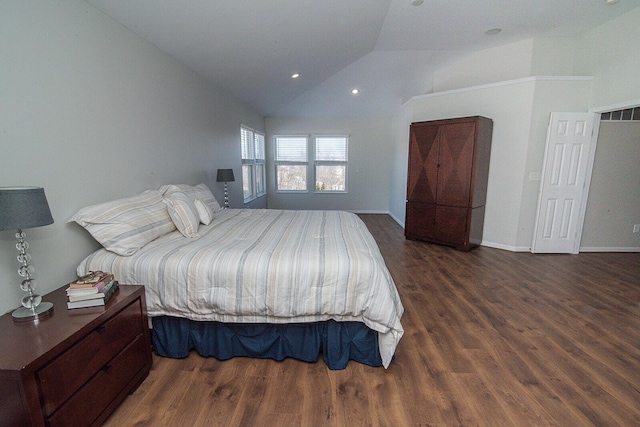 bedroom with dark wood-type flooring and lofted ceiling