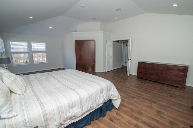 bedroom featuring vaulted ceiling and dark wood-type flooring