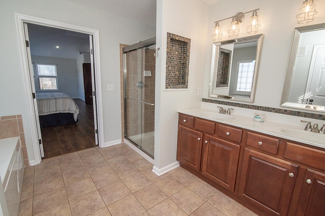 bathroom with tile patterned floors, vanity, and an enclosed shower