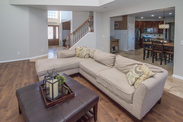 living room featuring dark hardwood / wood-style floors and french doors