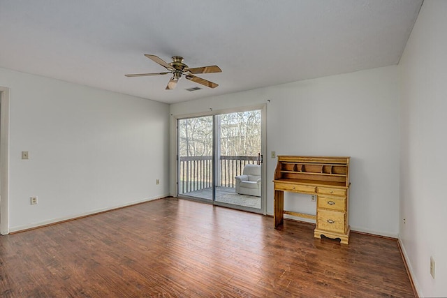 unfurnished room featuring dark hardwood / wood-style floors and ceiling fan