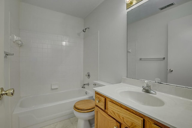 full bathroom featuring tile patterned flooring, vanity, toilet, and  shower combination