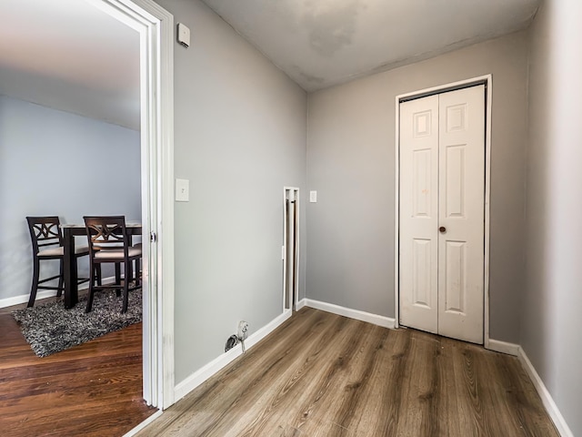 laundry room with hardwood / wood-style floors