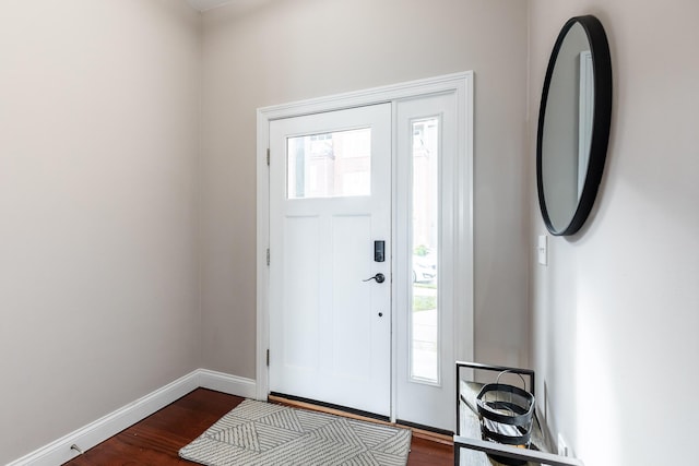 foyer featuring dark wood-type flooring