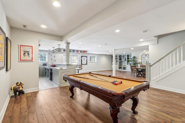 game room with ornate columns, pool table, and light hardwood / wood-style flooring