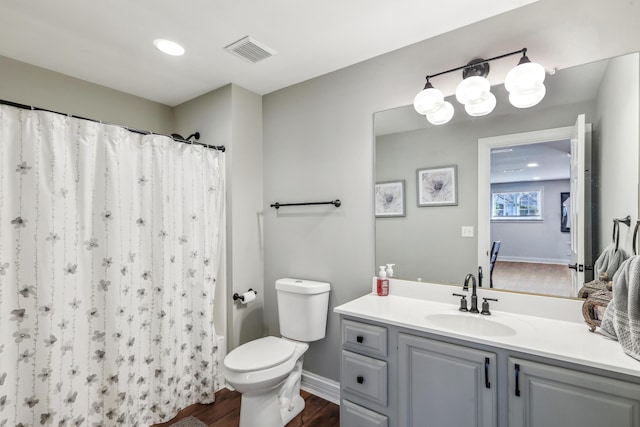 bathroom featuring toilet, vanity, wood-type flooring, and a shower with shower curtain