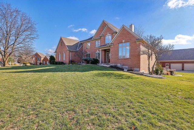 view of property with a front lawn and a garage