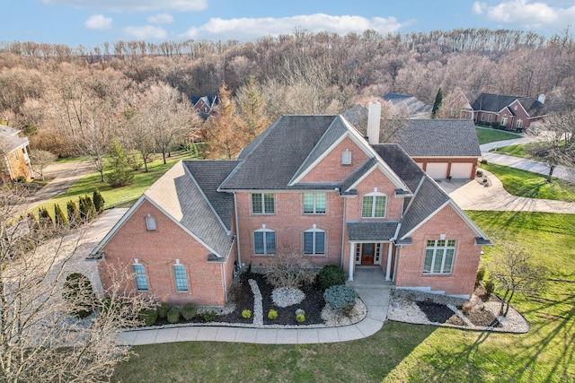 view of front of house with a garage and a front yard