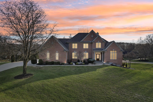 view of front of property with a lawn