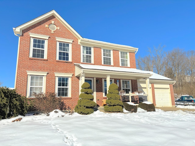 view of front facade featuring a porch and a garage