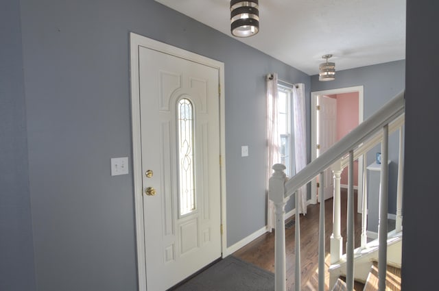 foyer with dark hardwood / wood-style floors