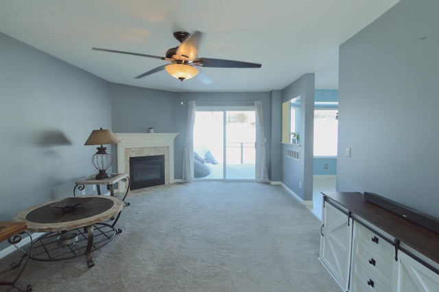 living room featuring ceiling fan and light carpet