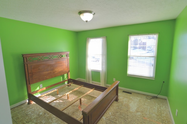 bedroom featuring a textured ceiling