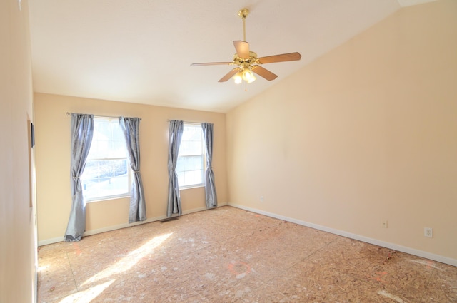 spare room featuring ceiling fan and vaulted ceiling