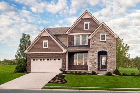 craftsman-style house featuring a front yard and a garage