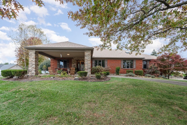 view of front of house with a front yard and a porch