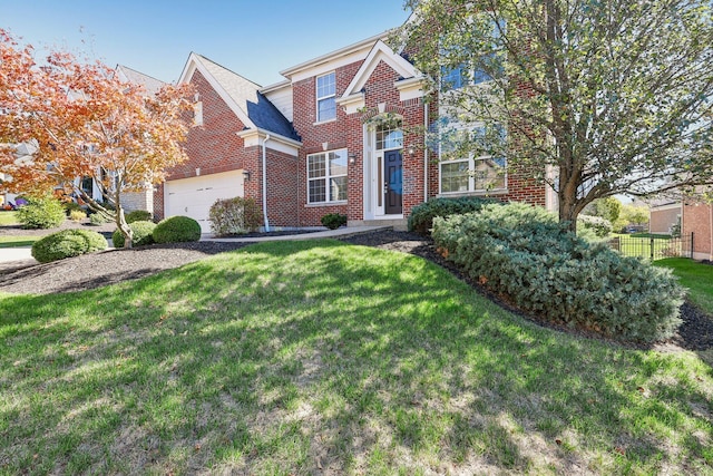 view of front of property with a garage and a front lawn