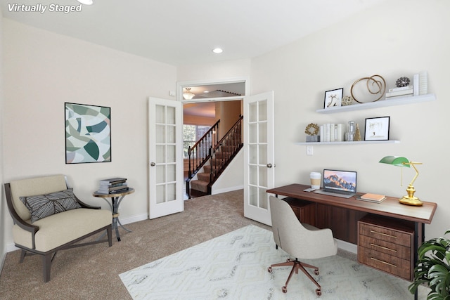 carpeted home office featuring french doors