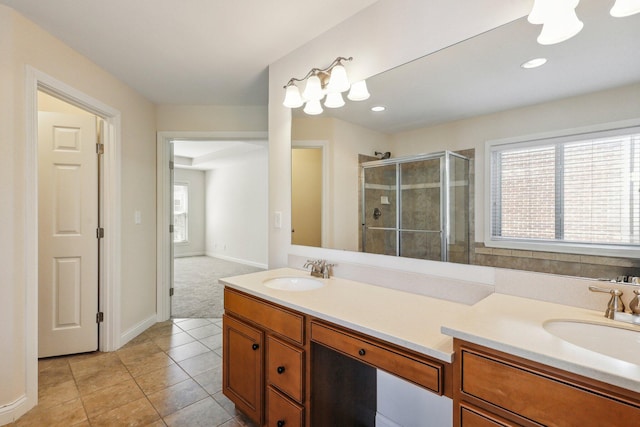 bathroom with tile patterned floors, walk in shower, and vanity