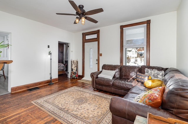 living room with ceiling fan and dark hardwood / wood-style floors