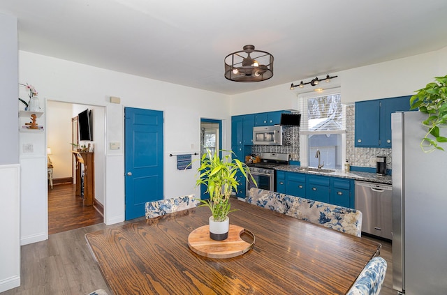 dining space featuring sink and dark hardwood / wood-style floors