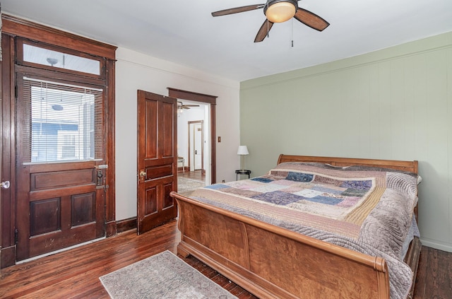 bedroom featuring ceiling fan and dark hardwood / wood-style flooring