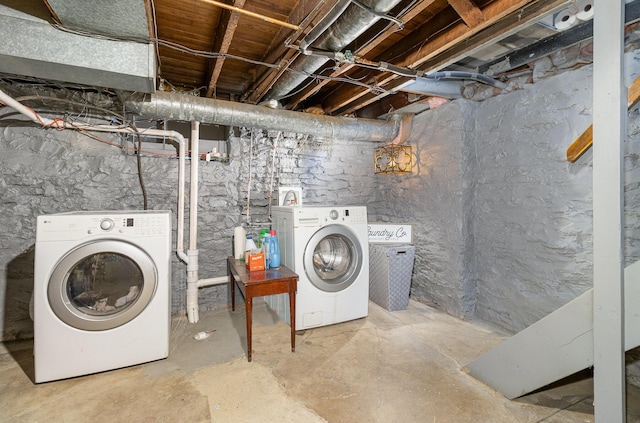 laundry area with independent washer and dryer