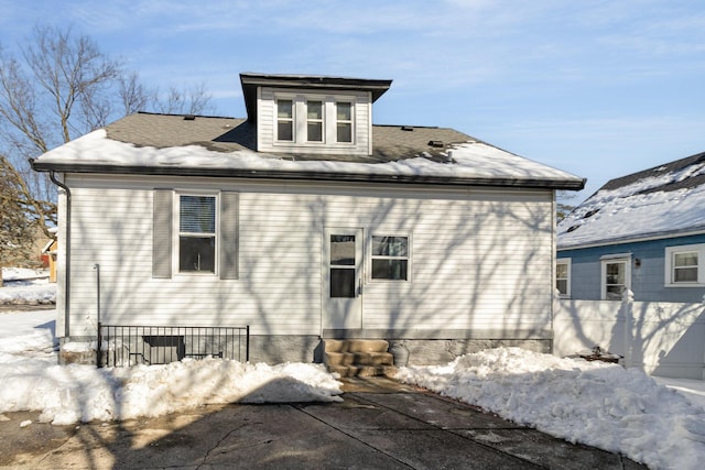 view of snow covered house