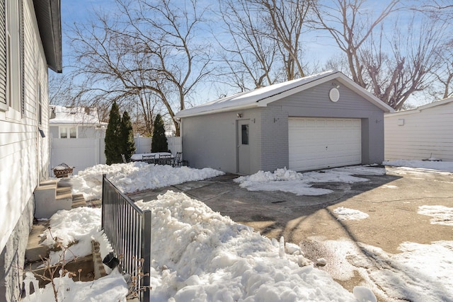 view of snow covered garage