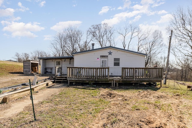 view of front of property featuring a wooden deck