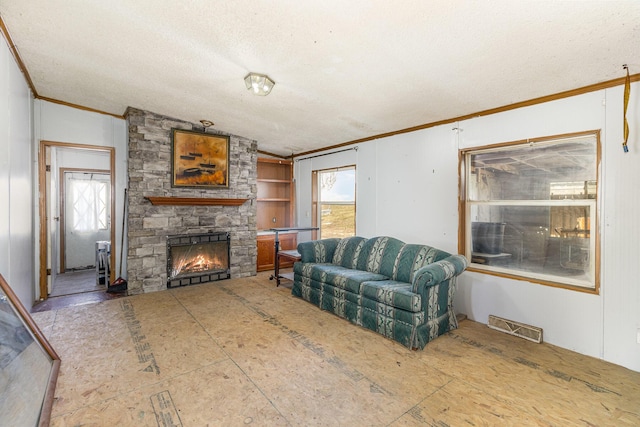 living area with lofted ceiling, plenty of natural light, a fireplace, and visible vents