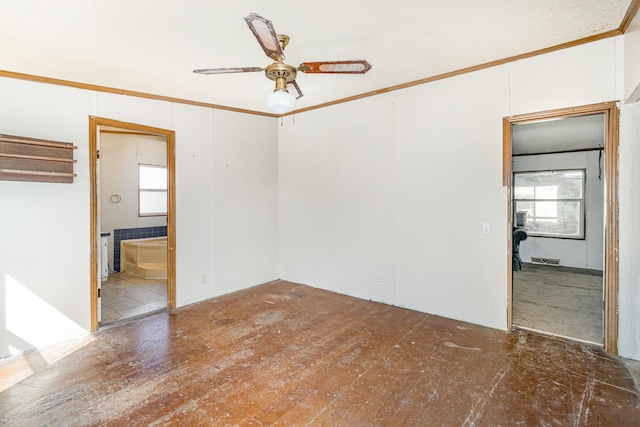 unfurnished room featuring crown molding and ceiling fan