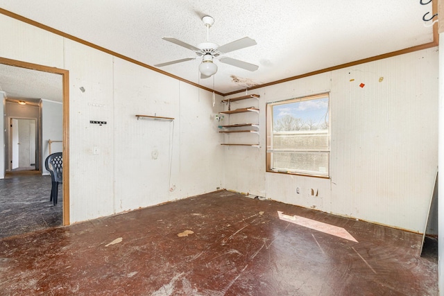 unfurnished room featuring a textured ceiling, ceiling fan, and ornamental molding