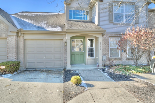 view of exterior entry with a garage