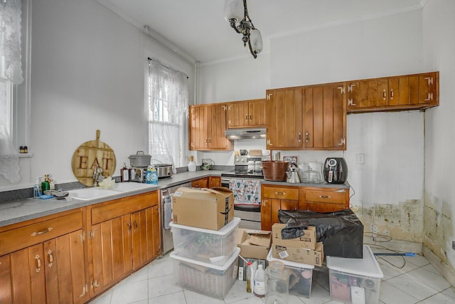 kitchen with appliances with stainless steel finishes, sink, crown molding, and light tile patterned flooring