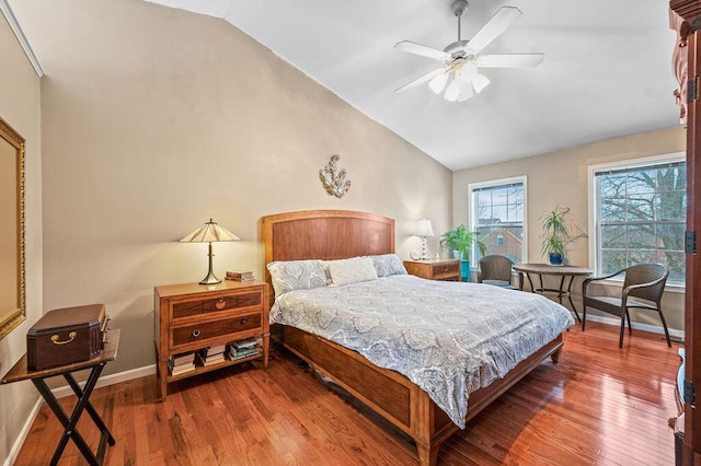 bedroom featuring ceiling fan, lofted ceiling, and hardwood / wood-style floors