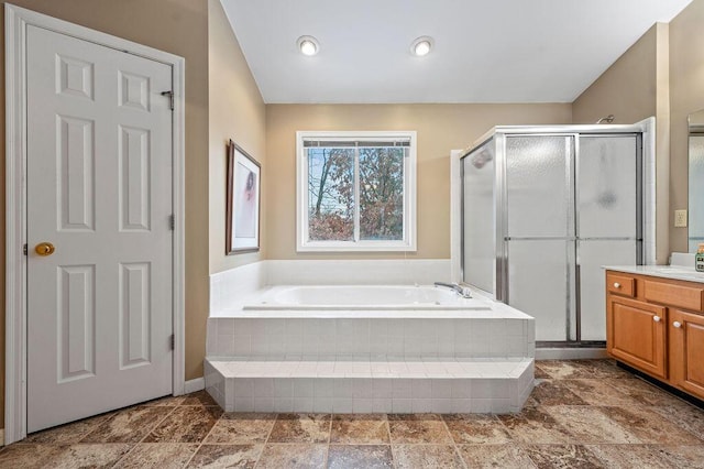 bathroom with vanity, lofted ceiling, and shower with separate bathtub