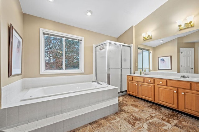 bathroom with vanity, vaulted ceiling, and shower with separate bathtub