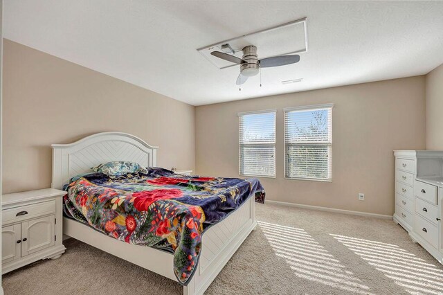 bedroom with light carpet and ceiling fan