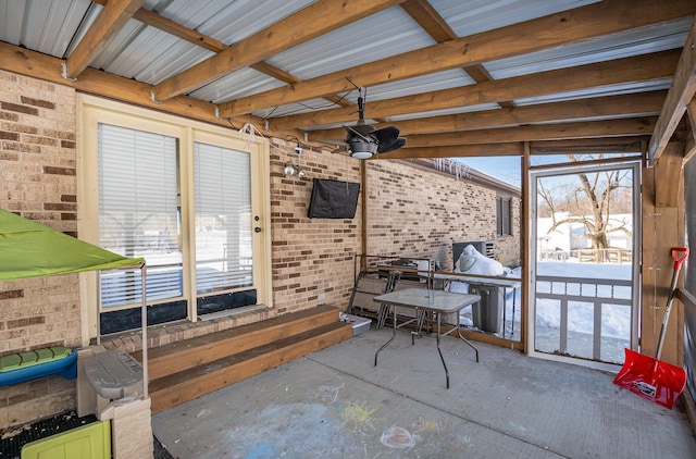 sunroom with ceiling fan and plenty of natural light