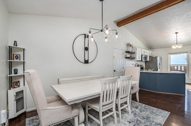 dining space with dark wood-type flooring, a textured ceiling, a chandelier, and vaulted ceiling with beams