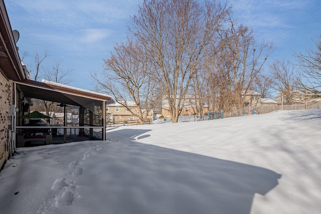 view of yard layered in snow