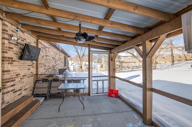 snow covered patio with ceiling fan